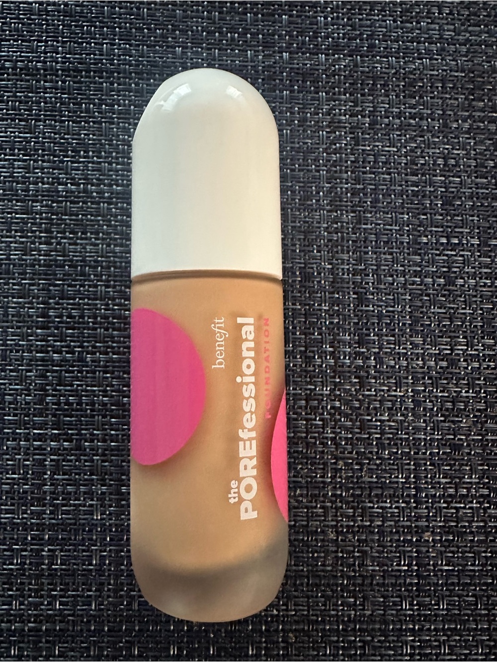 Benefit Liquid Foundation in Beige with Pink Accents and White Cap